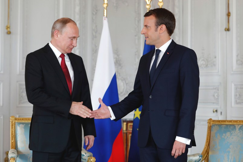 President Emmanuel Macron, right,  shakes hands with his Russian counterpart Vladimir Putin as they meet for talks before the opening of an exhibition marking 300 years of diplomatic ties between the two countyies at Palace of Versailles in Versailles, near Paris, France, Monday, May 29, 2017. Monday's meeting comes in the wake of the Group of Seven's summit over the weekend where relations with Russia were part of the agenda, making Macron the first Western leader to speak to Putin after the talks. (Philippe Wojazer/Pool Photo via AP)