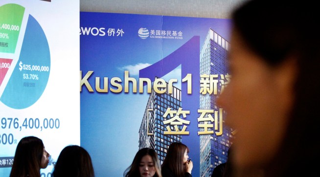 Chinese staffer wait for investors at a reception desk during an event promoting EB-5 investment in a Kushner Companies development at a hotel in Shanghai, China, Sunday, May. 7, 2017. The sister of President Donald Trump’s son-in-law, Jared Kushner, has been courting Chinese investors using a much-criticized federal visa program that provides a path toward obtaining green cards.