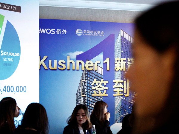 Chinese staffer wait for investors at a reception desk during an event promoting EB-5 investment in a Kushner Companies development at a hotel in Shanghai, China, Sunday, May. 7, 2017. The sister of President Donald Trump’s son-in-law, Jared Kushner, has been courting Chinese investors using a much-criticized federal visa program that provides a path toward obtaining green cards.