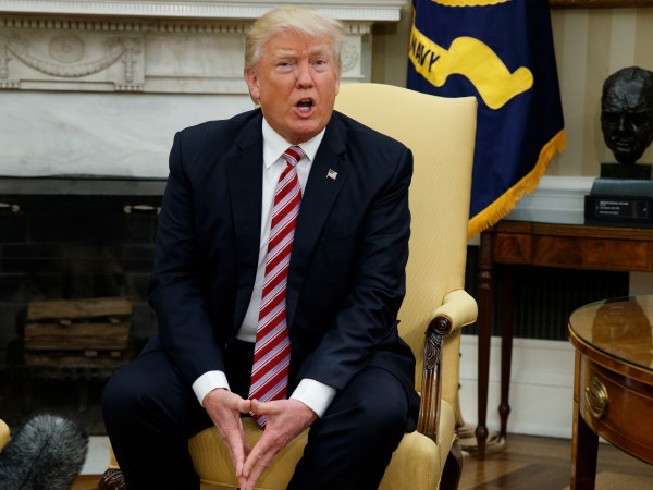 President Donald Trump talks to reporters during a meeting with former Secretary of State Henry Kissinger in the Oval Office of the White House, Wednesday, May 10, 2017, in Washington. (AP Photo/Evan Vucci)