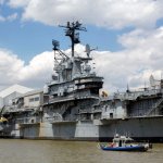 **HOLD FOR STORY BY TOM HAYS**In this Tuesday, May 2, 2017 photo, a New York Police Department boat patrols the Hudson River near the Intrepid Sea, Air & Space Museum in New York. Donald Trump will return to New York City for the first time since becoming president on Thursday and police are bracing for the possibility of large demonstrations. Trump is scheduled to meet the prime minister of Australia on the deck of the U.S.S. Intrepid, an aircraft carrrier that has been converted into a museum. (AP Photo/Mary Altaffer)