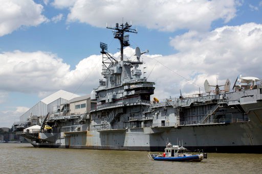 **HOLD FOR STORY BY TOM HAYS**In this Tuesday, May 2, 2017 photo, a New York Police Department boat patrols the Hudson River near the Intrepid Sea, Air & Space Museum in New York. Donald Trump will return to New York City for the first time since becoming president on Thursday and police are bracing for the possibility of large demonstrations. Trump is scheduled to meet the prime minister of Australia on the deck of the U.S.S. Intrepid, an aircraft carrrier that has been converted into a museum. (AP Photo/Mary Altaffer)
