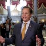 Rep. Dave Brat, R-Va.,  a member of the conservative Freedom Caucus, explains his position to a TV interviewer before his group meets with President Donald Trump as the GOP's long-promised legislation to repeal and replace "Obamacare" moves to a showdown vote, at the Capitol in Washington, Thursday, March 23, 2017. (AP Photo/J. Scott Applewhite)
