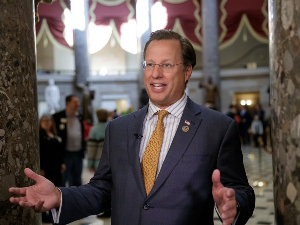 Rep. Dave Brat, R-Va.,  a member of the conservative Freedom Caucus, explains his position to a TV interviewer before his group meets with President Donald Trump as the GOP's long-promised legislation to repeal and replace "Obamacare" moves to a showdown vote, at the Capitol in Washington, Thursday, March 23, 2017. (AP Photo/J. Scott Applewhite)
