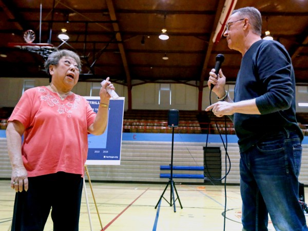 Rae Seaton, of Dubuque, Iowa, challenges U.S. Rep. Rod Blum, R-Iowa, on his answer to her healthcare question during a town hall in the Nora Gymnasium at Dubuque Senior High School in Dubuque, Iowa, on Monday, May 8, 2017.