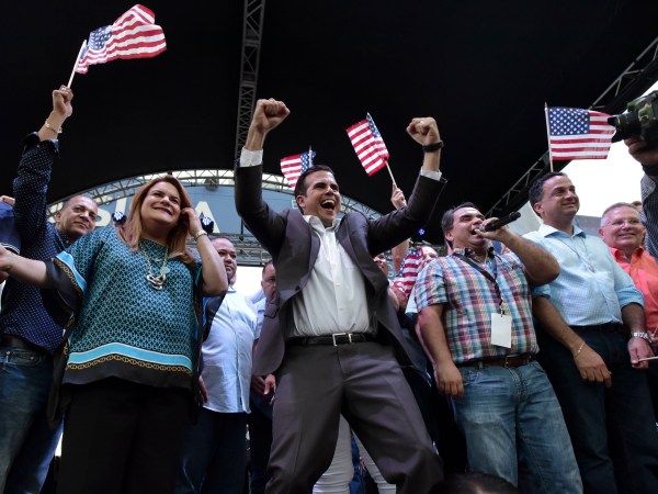 Governor Ricardo Rossello and Washington resident commissioner Jennifer Gonzalez celebrate at the headquarters of the New Progressive Party after learning about their victory in the political status referendum, in San Juan, Puerto Rico, Sunday, June 11, 2017. After the triumph of statehood in the status consultation, Rossello will move to Washington, DC, to report the results to Congress, the White House and various international forums.  (AP Photo/Carlos Giusti) PUERTO RICO OUT-NO PUBLICAR EN PUERTO RICO