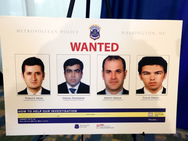 Pictures of people facing criminal charges are seen after a news conference about an altercation outside the Turkish Embassy in Washington during the visit of the Turkish President, Thursday, June 15, 2017, in Washington. Police say they've issued arrest warrants for a dozen Turkish security agents and two others accused of taking part in a violent altercation May 16 as Turkey's president visited Washington. (AP Photo/Alex Brandon)