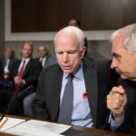 Senate Armed Services Committee Chairman John McCain, R-Ariz., left, confers with Sen. Jack Reed, D-R.I., the ranking member, at the start of a hearing at the Capitol in Washington, Tuesday, June 20, 2017.  (AP Photo/J. Scott Applewhite)