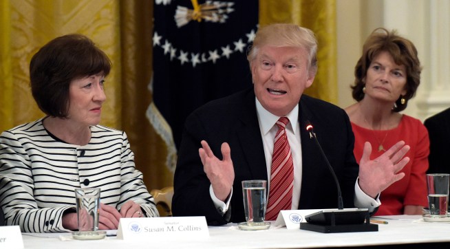 President Donald Trump, center, speaks as he meets with Republican senators on health care in the East Room of the White House in Washington, Tuesday, June 27, 2017. Sen. Susan Collins, R-Maine, left, and Sen. Lisa Murkowski, R-Alaska, right, listen (AP Photo/Susan Walsh)