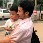 Chinese labor activist Hua Haifeng, center, carries his son Bobo chats with his sister Hua Xiaoqin, left, as they leave a police station after being released in Ganzhou in southern China's Jiangxi Province, Wednesday, June 28, 2017. Chinese authorities have released on bail three activists who had been detained after investigating labor conditions at a factory that produced shoes for Ivanka Trump and other brands. (AP Photo/Gerry Shih)