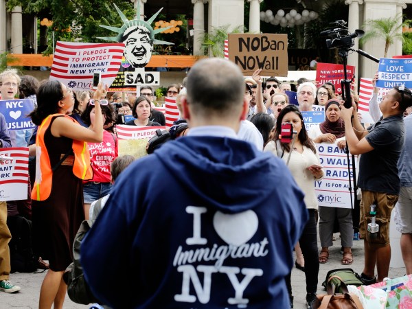 Protestors of a travel ban gather in Union Square Thursday, June 29, 2017, in New York. A scaled-back version of President Donald Trump's travel ban takes effect Thursday evening, stripped of provisions that brought protests and chaos at airports worldwide in January yet still likely to generate a new round of court fights.(AP Photo/Frank Franklin II)