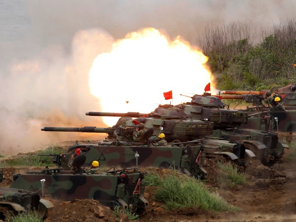 A line of M60A3 Patton main battle tank fire at a target during the annual Han Kuang exercises in outlying Penghu Island, Taiwan, Thursday, May 25, 2017. (AP Photo/Chiang Ying-ying)