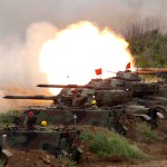 A line of M60A3 Patton main battle tank fire at a target during the annual Han Kuang exercises in outlying Penghu Island, Taiwan, Thursday, May 25, 2017. (AP Photo/Chiang Ying-ying)