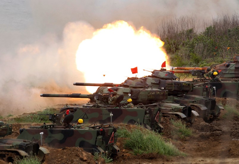 A line of M60A3 Patton main battle tank fire at a target during the annual Han Kuang exercises in outlying Penghu Island, Taiwan, Thursday, May 25, 2017. (AP Photo/Chiang Ying-ying)