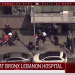 In this image taken from video provided by WNBC 4 New York, emergency personnel converge on Bronx Lebanon Hospital in New York, Friday, June 30, 2017. Police say at least two people have been shot at a New York City hospital and the gunman is still at large. (NBC 4 New York via AP)