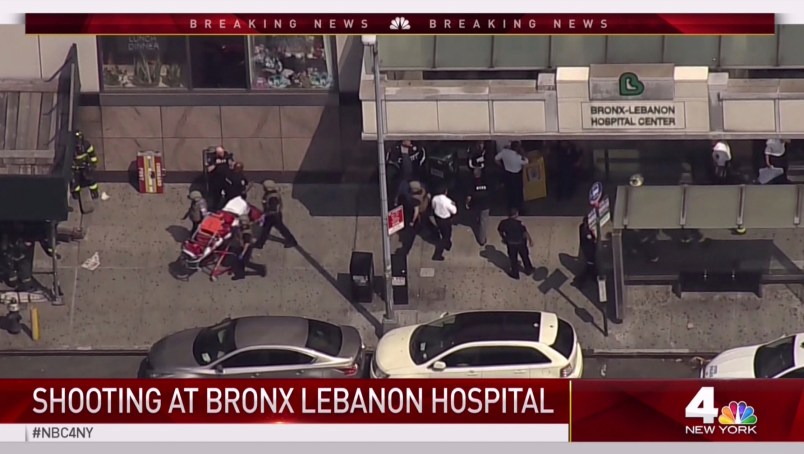 In this image taken from video provided by WNBC 4 New York, emergency personnel converge on Bronx Lebanon Hospital in New York, Friday, June 30, 2017. Police say at least two people have been shot at a New York City hospital and the gunman is still at large. (NBC 4 New York via AP)