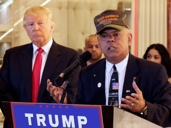 Republican presidential candidate Donald Trump listens at ;eft as Al Baldasaro, a New Hampshire state representative, speaks during a news conference in New York, Tuesday, May 31, 2016. (AP Photo/Richard Drew)