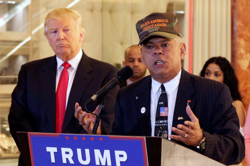 Republican presidential candidate Donald Trump listens at ;eft as Al Baldasaro, a New Hampshire state representative, speaks during a news conference in New York, Tuesday, May 31, 2016. (AP Photo/Richard Drew)