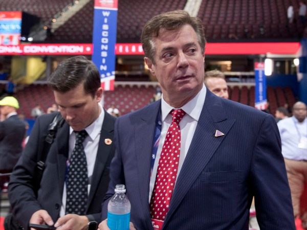FILE - In this July 18, 2016, file photo, Trump campaign chairman Paul Manafort walks around the convention floor before the opening session of the Republican National Convention in Cleveland. Hillary Clinton’s campaign is questioning Donald Trump’s top political aide’s ties to a pro-Kremlin political party in Ukraine, claiming it is evidence of the Republican nominee’s cozy relationship with Russia. The New York Times reported that handwritten ledgers found in Ukraine show $12.7 million in undisclosed payments to Paul Manafort from the pro-Russia party founded by the country’s former president Viktor Yanukovych. (AP Photo/Carolyn Kaster, File)