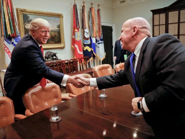President Donald Trump shakes hands with Rep. Kevin Brady, R-Texas, right, during a meeting with House and Senate legislators in the Roosevelt Room of the White House in Washington, Thursday, Feb. 2, 2017. (AP Photo/Pablo Martinez Monsivais)