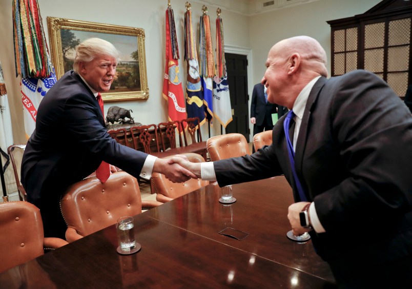 President Donald Trump shakes hands with Rep. Kevin Brady, R-Texas, right, during a meeting with House and Senate legislators in the Roosevelt Room of the White House in Washington, Thursday, Feb. 2, 2017. (AP Photo/Pablo Martinez Monsivais)