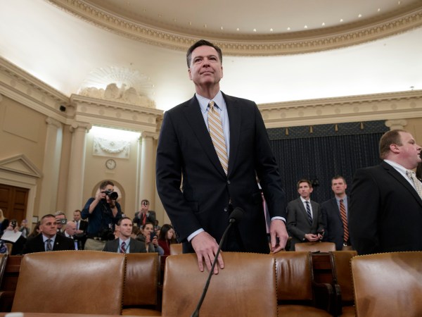 FBI Director James Comey arrives to testify as the House Permanent Select Committee on Intelligence holds first public hearing on allegations of Russian interference in the 2016 U.S. presidential election, and the murky web of contacts between President Donald Trump's campaign and Russia, on Capitol Hill in Washington, Monday, March 20, 2017. (AP Photo/J. Scott Applewhite)