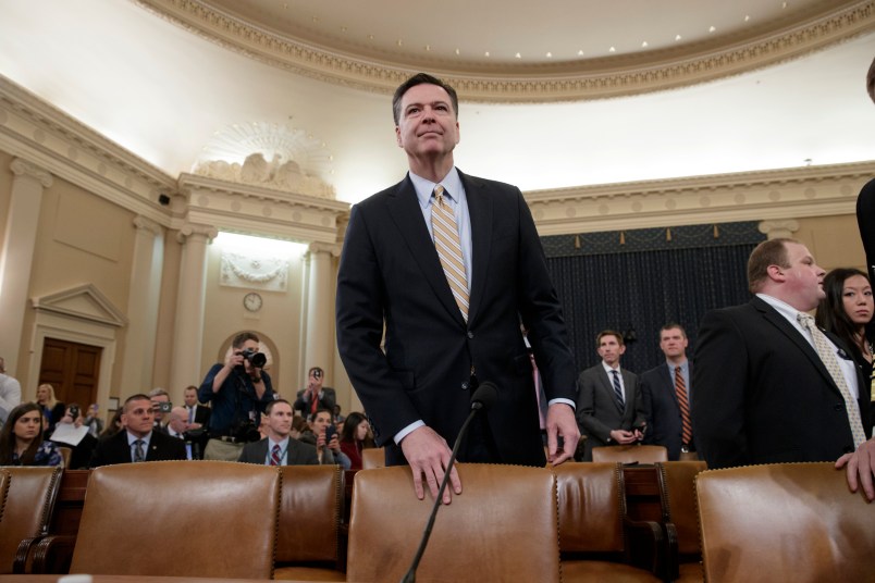 FBI Director James Comey arrives to testify as the House Permanent Select Committee on Intelligence holds first public hearing on allegations of Russian interference in the 2016 U.S. presidential election, and the murky web of contacts between President Donald Trump's campaign and Russia, on Capitol Hill in Washington, Monday, March 20, 2017. (AP Photo/J. Scott Applewhite)