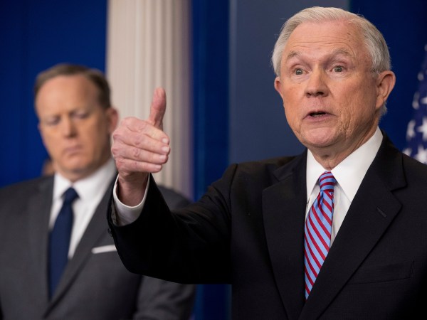Attorney General Jeff Sessions, right, accompanied by White House press secretary Sean Spicer, left, talks to the media during the daily press briefing at the White House, Monday, March 27, 2017, in Washington. (AP Photo/Andrew Harnik)