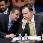 Conservative members of the Senate Judiciary Committee, Sen. Ted Cruz, R-Texas, left, and Sen. Mike Lee, R-Utah, confer as the Republican-led panel meets to advance the nomination of President Donald Trump's Supreme Court nominee Neil Gorsuch to fill the vacancy left by the late Antonin Scalia, on Capitol Hill in Washington, Monday, April 3, 2017.  A weeklong partisan showdown is expected as Democrats are steadily amassing the votes to block Judge Gorsuch and force Republicans to unilaterally change long-standing rules to confirm him.   (AP Photo/J. Scott Applewhite)