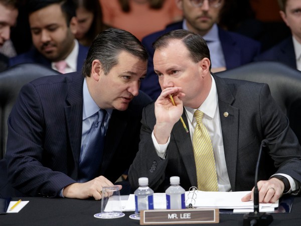 Conservative members of the Senate Judiciary Committee, Sen. Ted Cruz, R-Texas, left, and Sen. Mike Lee, R-Utah, confer as the Republican-led panel meets to advance the nomination of President Donald Trump's Supreme Court nominee Neil Gorsuch to fill the vacancy left by the late Antonin Scalia, on Capitol Hill in Washington, Monday, April 3, 2017.  A weeklong partisan showdown is expected as Democrats are steadily amassing the votes to block Judge Gorsuch and force Republicans to unilaterally change long-standing rules to confirm him.   (AP Photo/J. Scott Applewhite)