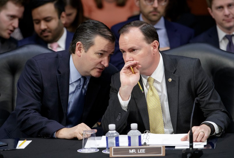 Conservative members of the Senate Judiciary Committee, Sen. Ted Cruz, R-Texas, left, and Sen. Mike Lee, R-Utah, confer as the Republican-led panel meets to advance the nomination of President Donald Trump's Supreme Court nominee Neil Gorsuch to fill the vacancy left by the late Antonin Scalia, on Capitol Hill in Washington, Monday, April 3, 2017.  A weeklong partisan showdown is expected as Democrats are steadily amassing the votes to block Judge Gorsuch and force Republicans to unilaterally change long-standing rules to confirm him.   (AP Photo/J. Scott Applewhite)
