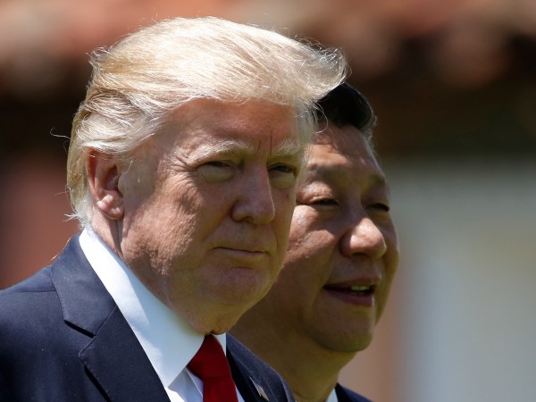 President Donald Trump and Chinese President Xi Jinping walk together at Mar-a-Lago, Friday, April 7, 2017, in Palm Beach, Fla. Trump was meeting again with his Chinese counterpart Friday, with U.S. missile strikes on Syria adding weight to his threat to act unilaterally against the nuclear weapons program of China's ally, North Korea. (AP Photo/Alex Brandon)