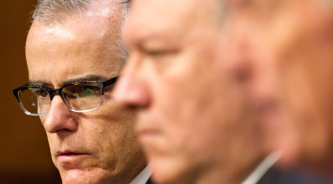 Acting FBI Director Andrew McCabe, left, next to CIA Director Mike Pompeo, listens as Director of National Intelligence Dan Coats testifies at a Senate Intelligence Committee hearing, on Capitol Hill in Washington, Thursday, May 11, 2017. It is an annual hearing about the major threats facing the U.S., but former FBI Director Jim Comey's sudden firing is certain to be a focus of questions. (AP Photo/Jacquelyn Martin)