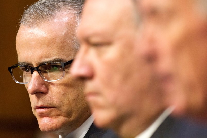 Acting FBI Director Andrew McCabe, left, next to CIA Director Mike Pompeo, listens as Director of National Intelligence Dan Coats testifies at a Senate Intelligence Committee hearing, on Capitol Hill in Washington, Thursday, May 11, 2017. It is an annual hearing about the major threats facing the U.S., but former FBI Director Jim Comey's sudden firing is certain to be a focus of questions. (AP Photo/Jacquelyn Martin)