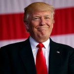 President Donald Trump smiles as he is introduced to speak to U.S. military troops and their families at Naval Air Station Sigonella, Saturday, May 27, 2017, in Sigonella, Italy. (AP Photo/Evan Vucci)