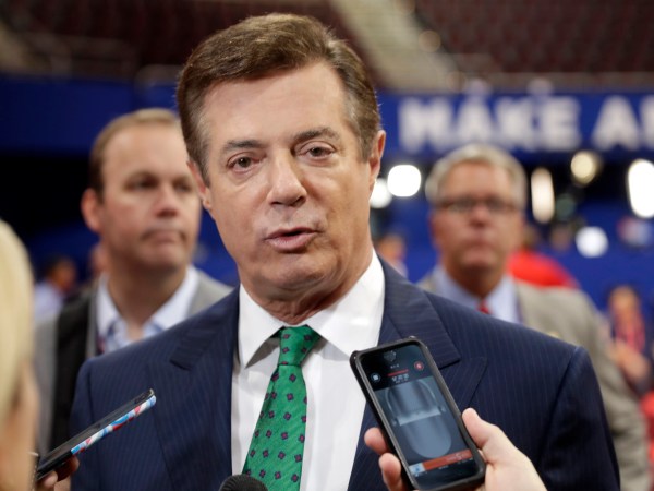 FILE - In this July 17, 2016 file photo, Trump Campaign Chairman Paul Manafort talks to reporters on the floor of the Republican National Convention at Quicken Loans Arena, Sunday, in Cleveland.  Republican Donald Trump announced a shakeup of his campaign leadership Wednesday, the latest sign of tumult in his bid for the White House as his poll numbers slip and only 82 days remain before the election.   (AP Photo/Matt Rourke)