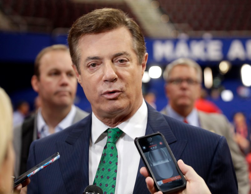 FILE - In this July 17, 2016 file photo, Trump Campaign Chairman Paul Manafort talks to reporters on the floor of the Republican National Convention at Quicken Loans Arena, Sunday, in Cleveland.  Republican Donald Trump announced a shakeup of his campaign leadership Wednesday, the latest sign of tumult in his bid for the White House as his poll numbers slip and only 82 days remain before the election.   (AP Photo/Matt Rourke)