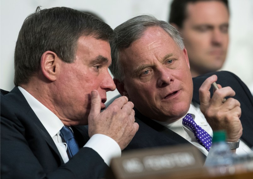 Senate Intelligence Committee Vice Chairman Mark Warner, D-Va., left, confers with Sen. Richard Burr, R-N.C., chairman of the Intelligence Committee as the panel questions top national security chiefs about the  gathering of intelligence on foreign agents, on Capitol Hill in Washington, Wednesday, June 7, 2017. (AP Photo/J. Scott Applewhite)