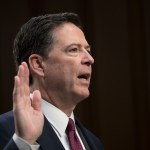 Fired FBI director James Comey is sworn in as he prepares to testify about a series of conversations with President Donald Trump, before the Senate Select Committee on Intelligence on Capitol Hill in Washington, Thursday, June 8, 2017. Comey alleges Trump repeatedly pressed him for his "loyalty" and directly pushed him to "lift the cloud" of investigation by declaring publicly the president was not the target of the probe into his campaign's Russia ties.   (AP Photo/J. Scott Applewhite)