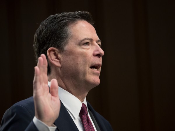 Fired FBI director James Comey is sworn in as he prepares to testify about a series of conversations with President Donald Trump, before the Senate Select Committee on Intelligence on Capitol Hill in Washington, Thursday, June 8, 2017. Comey alleges Trump repeatedly pressed him for his "loyalty" and directly pushed him to "lift the cloud" of investigation by declaring publicly the president was not the target of the probe into his campaign's Russia ties.   (AP Photo/J. Scott Applewhite)