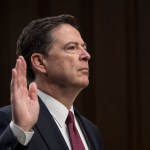 Fired FBI director James Comey is sworn in as he prepares to testify about a series of conversations with President Donald Trump, before the Senate Select Committee on Intelligence on Capitol Hill in Washington, Thursday, June 8, 2017. Comey alleges Trump repeatedly pressed him for his "loyalty" and directly pushed him to "lift the cloud" of investigation by declaring publicly the president was not the target of the probe into his campaign's Russia ties.   (AP Photo/J. Scott Applewhite)