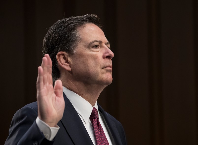 Fired FBI director James Comey is sworn in as he prepares to testify about a series of conversations with President Donald Trump, before the Senate Select Committee on Intelligence on Capitol Hill in Washington, Thursday, June 8, 2017. Comey alleges Trump repeatedly pressed him for his "loyalty" and directly pushed him to "lift the cloud" of investigation by declaring publicly the president was not the target of the probe into his campaign's Russia ties.   (AP Photo/J. Scott Applewhite)