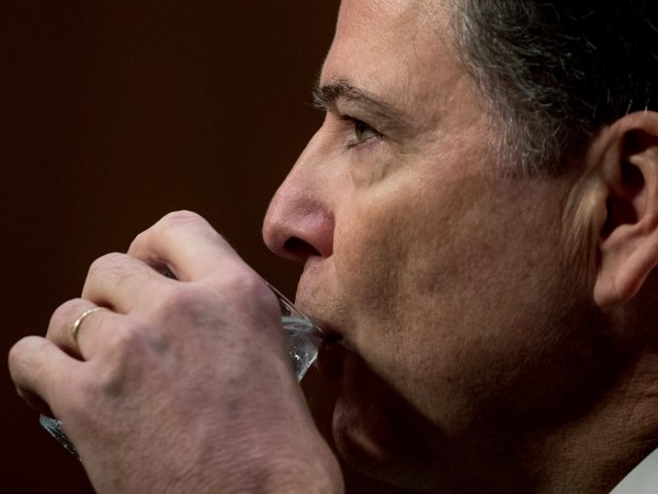 Former FBI Director James Comey takes a drink of water as he testifies at a Senate Intelligence Committee hearing on Capitol Hill, Thursday, June 8, 2017, in Washington. (AP Photo/Andrew Harnik)