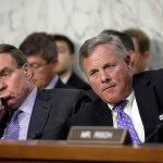 Sen. Richard Burr, R-N.C., right, chairman of the Senate Select Committee on Intelligence, and Vice Chairman Mark Warner, D-Va., left, listen as Attorney General Jeff Sessions testifies before the Senate Select Committee on Intelligence about his role in the firing of FBI Director James Comey and the investigation into contacts between Trump campaign associates and Russia, on Capitol Hill in Washington, Tuesday, June 13, 2017. (AP Photo/J. Scott Applewhite)