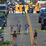 Police and emergency personnel are seen near the scene where House Majority Whip Steve Scalise of La. was shot during a Congressional baseball practice in Alexandria, Va., Wednesday, June 14, 2017.  (AP Photo/Cliff Owen)