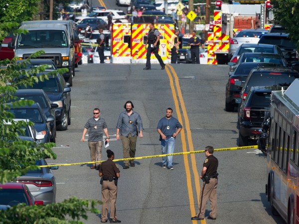 Police and emergency personnel are seen near the scene where House Majority Whip Steve Scalise of La. was shot during a Congressional baseball practice in Alexandria, Va., Wednesday, June 14, 2017.  (AP Photo/Cliff Owen)