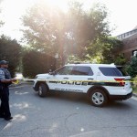 An Alexandria police officer tapes off an area near the YMCA after a shooting Wednesday, June 14, 2017, in Alexandria, Va. A top House Republican, Steve Scalise of Louisiana, was shot Wednesday at a congressional baseball practice. (AP Photo/Alex Brandon)