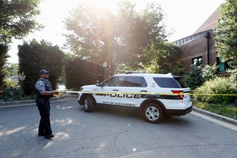 An Alexandria police officer tapes off an area near the YMCA after a shooting Wednesday, June 14, 2017, in Alexandria, Va. A top House Republican, Steve Scalise of Louisiana, was shot Wednesday at a congressional baseball practice. (AP Photo/Alex Brandon)
