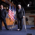 Rep. Roger Williams, R-Texas, who injured his ankle during a shooting at a congressional baseball game, leaves a news conference on crutches, assisted by his aide J. Spencer Freebairn, left, at the Capitol in Washington, Wednesday, June 14, 2017.  (AP Photo/J. Scott Applewhite)