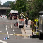 FBI Agents investigate a car on E. Monroe Ave. in Alexandria, Va., Thursday, June 15, 2017, the day after House Majority Whip Steve Scalise of La. was shot during during a congressional baseball practice nearby. (AP Photo/Jacquelyn Martin)